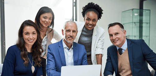 Image - Portrait of a group of businesspeople working together on a laptop in a modern office Image - Portrait of a group of businesspeople working together on a laptop in a modern office